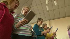 Churchgoers using hand-held computers