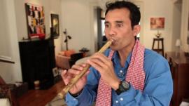 Arn Chorn-Pond playing a musical pipe