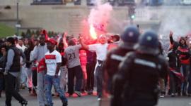 PSG supporters squaring up to riot police