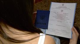 Hayley Stobo holds her certificate