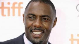 Cast member Idris Elba poses on the red carpet before a screening of the film