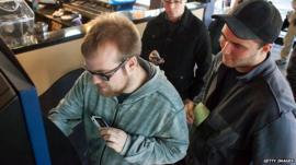 People queue up to use the world's first Bitcoin ATM