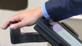 A palm being scanned by the Pulse Wallet