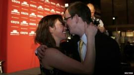 Nathan Filer is congratulated by his wife Emily after winning the Costa Book Award