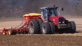 A tractor ploughing a field