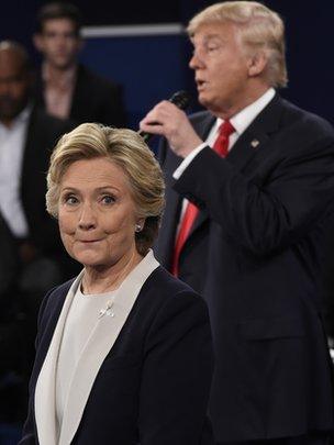 Republican Presidential nominee Donald Trump participate in a town hall debate against Democratic nominee Hillary Clinton (L) at Washington University in St. Louis, Missouri, on October 9, 2016.