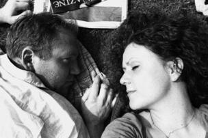 Two people lying in the park