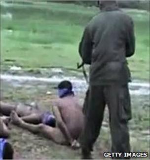 Video grab allegedly showing a soldier about to execute a rebel