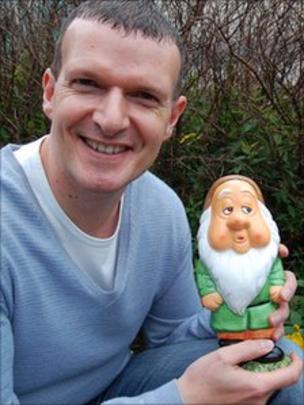 Image caption BBC Radio Derby breakfast presenter Phil Trow named his gnome Derek - _54159730_philtrowgnome