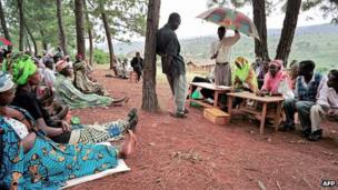 A genocide suspect stands under a tree that acts as a gacaca court