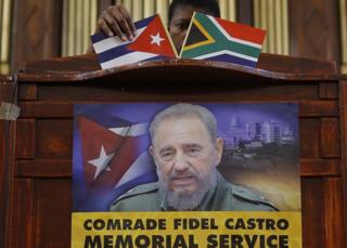 An official prepares the stage prior to a ANC memorial for the late Cuban President Fidel Castro, at the the Johannesburg City Hall, Johannesburg, South Africa - Wednesday 30 November 2016