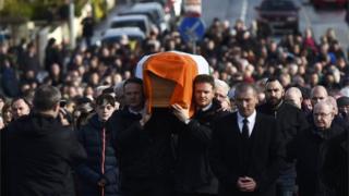 Martin McGuinness' sons Fiachra and Emmet carry their father's coffin