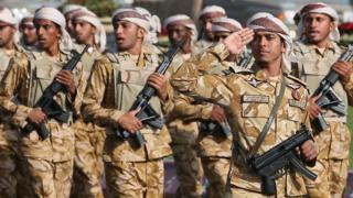 Qatari army forces take part in a military parade during the Gulf emirate's National Day celebrations in Doha 18 December 2013