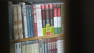 Books in the shop, seen through a window
