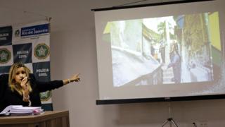 Police investigator Cristiana Bento points to a screen during a press conference in Rio de Janeiro on 17 June