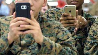 US Marines holding smartphones