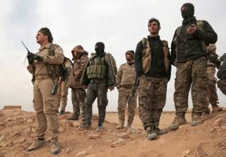 Syrian Democratic Forces (SDF) fighters gather during an offensive against Islamic State militants in northern Raqqa province, Syria, 8 February 2017.