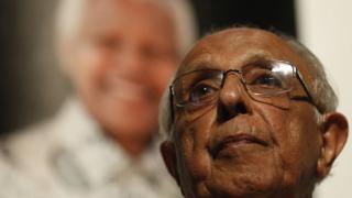 Anti-apartheid activist and close friend of former South African President Nelson Mandela, Ahmed Kathrada, talks during a tribute to Mandela at Gandhi Hall, on December 8, 2013