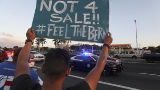 Sanders supporters back their man at the debate venue in Kendall, Florida