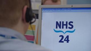 NHS 24 operator at screen