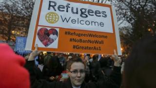 Protesters outside the White House after President Donald Trump signed an executive order on a revised travel ban.