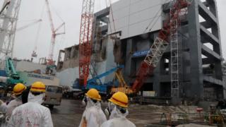Covers are installed on the unit 4 reactor building at Tokyo Electric Power Company's Fukushima Dai-ichi nuclear plant in the town of Okuma, Fukushima prefecture in Japan on 12 June 2013