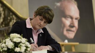 Arlene Foster signs the book of condolence