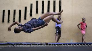 A girl jumps on one of the trampolines at the Alexandra Trampoline Club in Johannesburg, South Africa - Thursday 1 December 2016