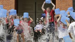 Massachusetts Governor Charlie Baker and his deputy Karyn Polito participate in the Ice Bucket Challenge on 10 August 2015 in Boston