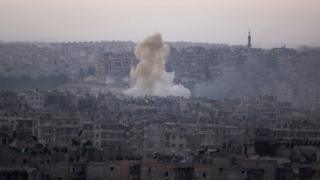 Smoke rises from Bustan al-Basha neighborhood of Aleppo
