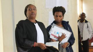 Violette Uwamahoro with one of her lawyers
