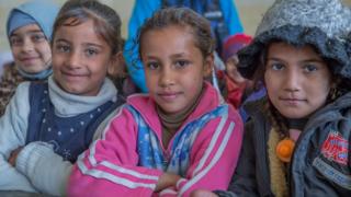 (From left) Heba, Noor, and Janna are back in class at a recently re-opened school in eastern Mosul (23 January 2017)