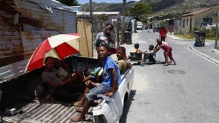 South African children play on a street in Masiphumelele, Cape Town, South Africa - Thursday 1 December 2016
