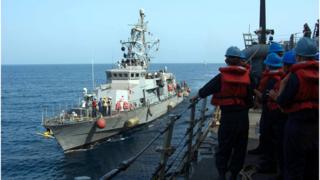 A file image released by the US Navy shows a Cyclone-class patrol craft USS Tempest (PC 2) coming alongside to perform a replenishment-at-sea through rafting with the guided-missile destroyer USS Mason (DDG 87) on September 12, 2016.