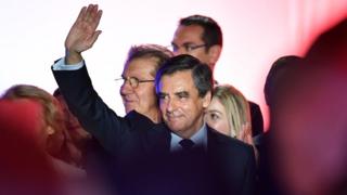 French presidential election candidate for the right-wing Les Republicains (LR) party Francois Fillon waves on March 2, 2017 during a public rally in Nimes,