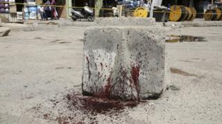 Blood-stain stone at location of blast