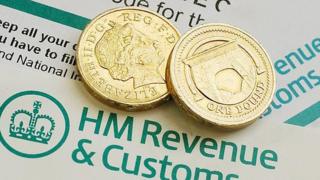 Tax form and coins