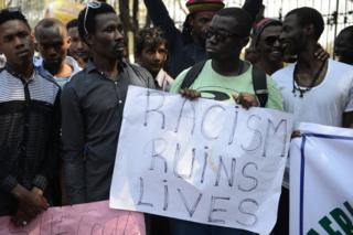 Members of the African Students Association hold placards during a protest in Hyderabad on February 6, 2016