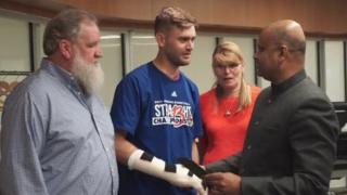 Ian Grillot shakes hands with Indian Consul General in Houston Anupam Ray