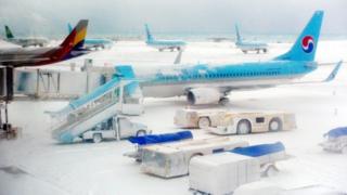 Planes and snow at Jeju International Airport