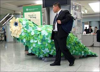 Man and bird sculpture at CBD conference
