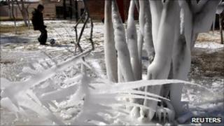 A child plays football in an icebound park in Ciudad Juarez