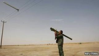 Rebel fires rocket at an air force jet near Brega - 2 March