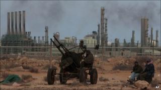 Libyan rebels in front the refinery oil complex in Ras Lanuf, Libya, on 11 March, 2011