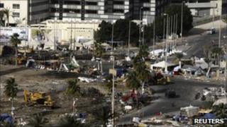 Heavy machinery clears the opposition camp at Pearl Square, Manama