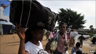 People fleeing Abobo after the shelling