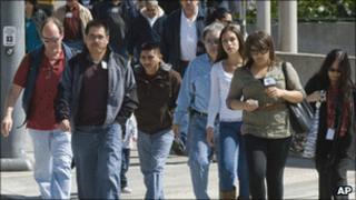 Jurors and court workers leave a courthouse in California in March