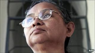 Kamariah Ali waits outside a courtroom before her trial at Federal Courthouse in Kuala Lumpur, 29 November 2005.