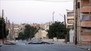 Deserted street in Hama, photographed during a government-organised tour (7 August 2011)