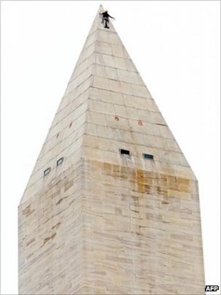 A worker inspects the top of the Washington Monument 27 Sept 2011